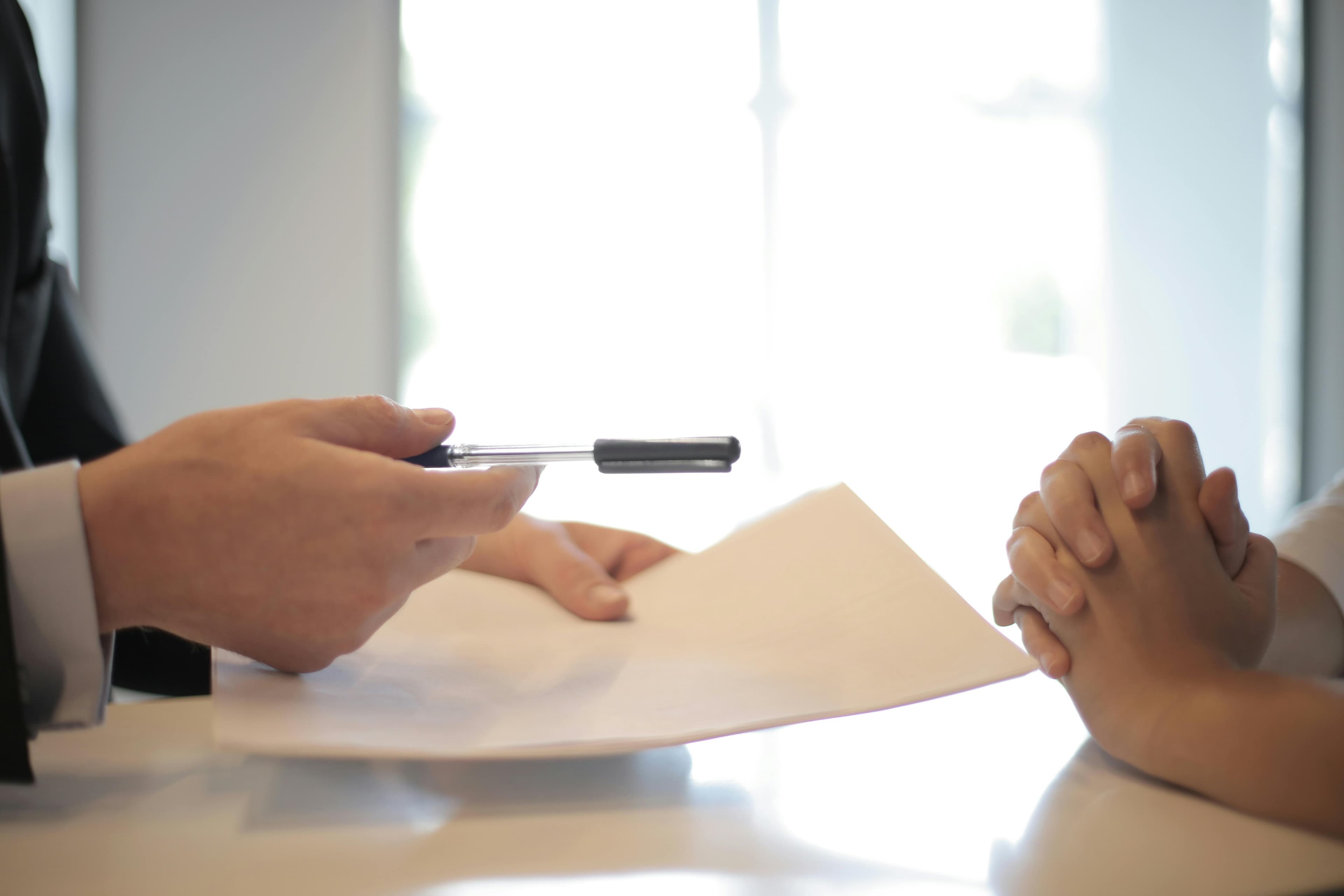 Two professionals shaking hands after a business agreement