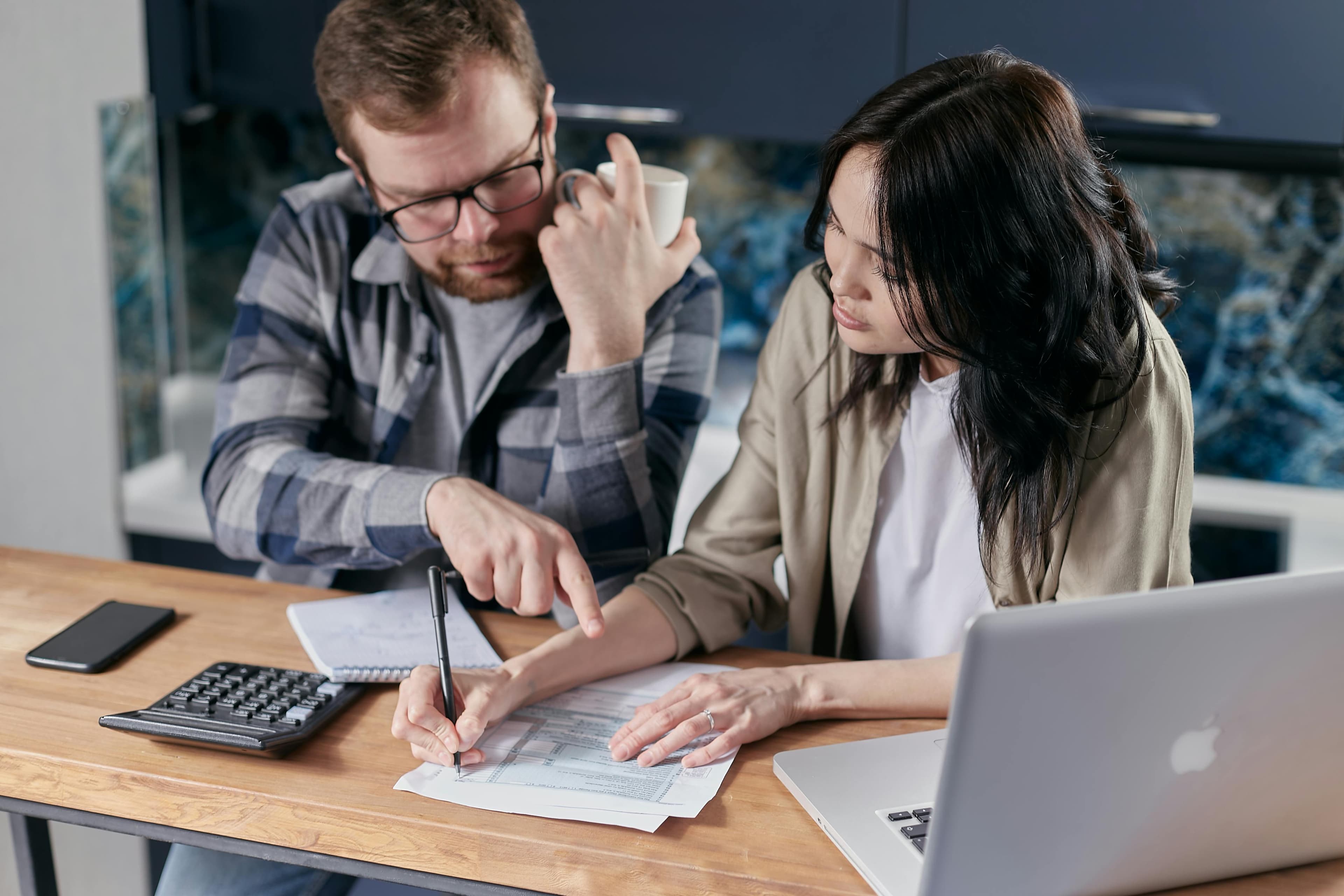 Lawyer consulting privately with a client over documents